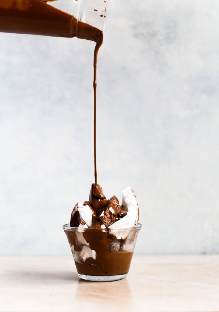 melted chocolate poured over coconut