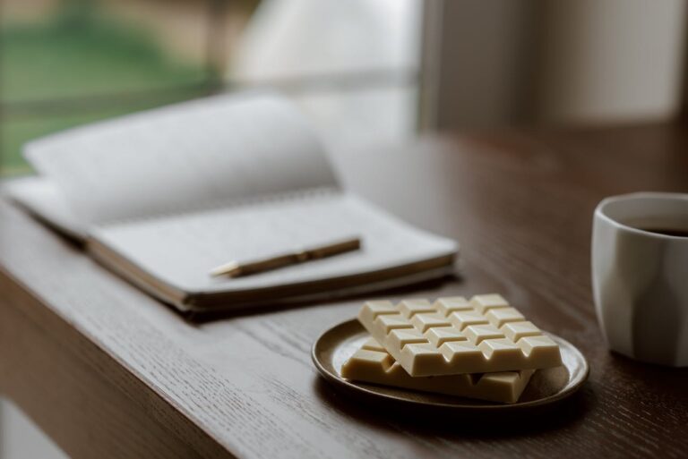 Notebook, pen, chocolate and mug